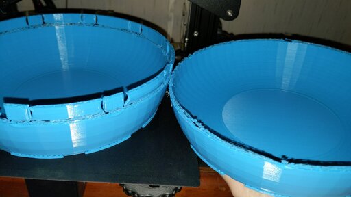 Two prints of bowl-shaped 3d-printed objects with clear underextrusion issues starting a couple of inches above the print bed. The second went longer and started extruding the correct amount later in the print.